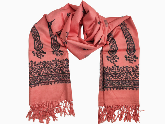 Peach-colored cotton silk blend shawl with a classic black paisley pattern. Lightweight and elegant, perfect for any occasion.