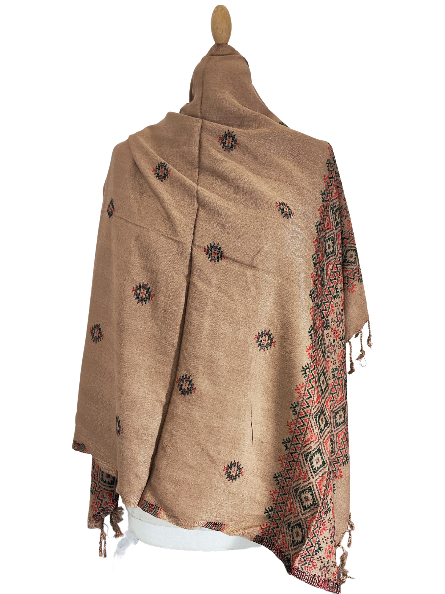 Stunning tan and brown shawl, featuring intricate embroidery in vibrant shades of red, black, and green, geometric patterns