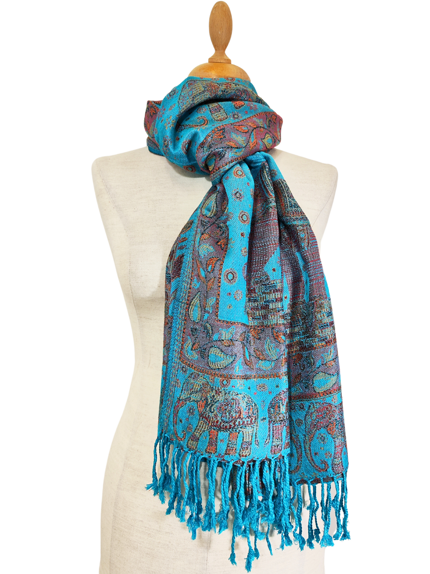 Beautiful pashmina shawl with a vibrant design. It has a predominantly turquoise background with intricate floral and elephant motifs in shades of red, gold, and blue