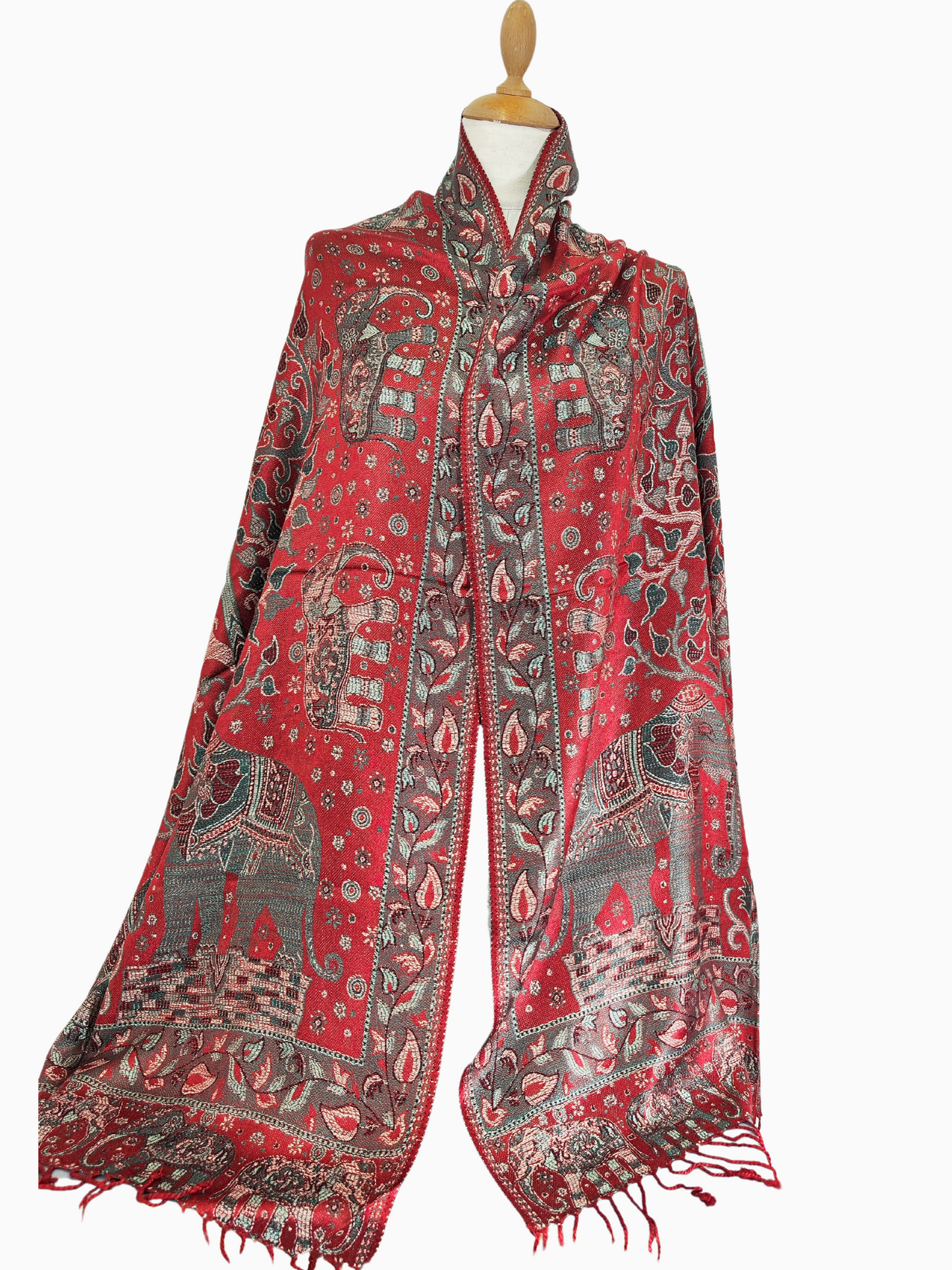 Beautiful pashmina shawl with a vibrant design. It has a predominantly red background with intricate floral and elephant motifs in shades of red, gold, and blue