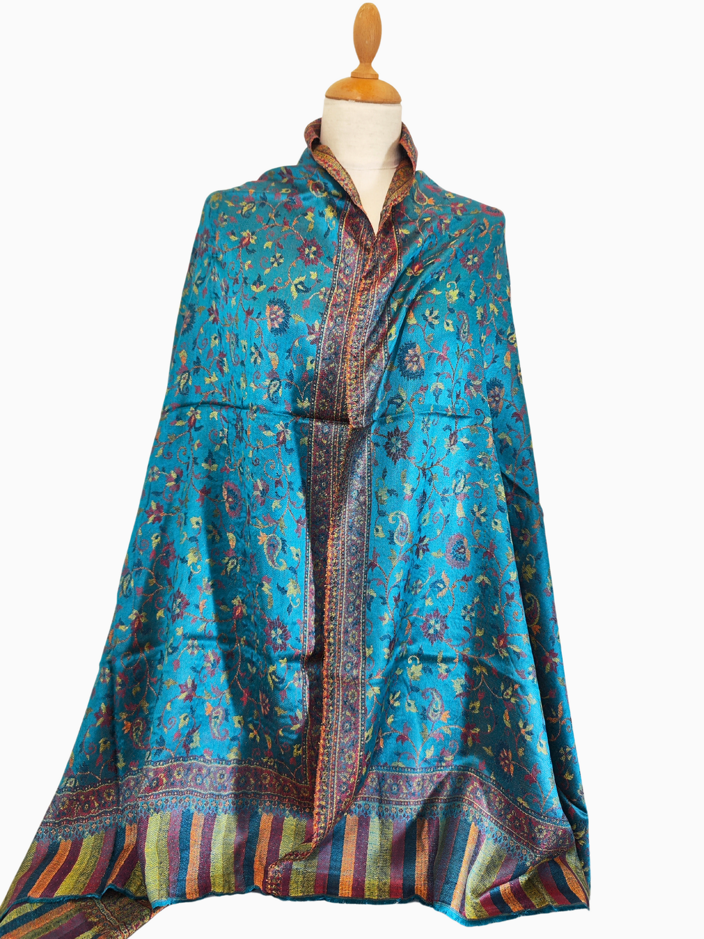 Elegant Turquoise Shawl with Vibrant Abstract Floral Design, vibrant abstract floral patterns. The design features an artful blend of colors, including soft pink, sunny yellow, fiery orange, and serene blue