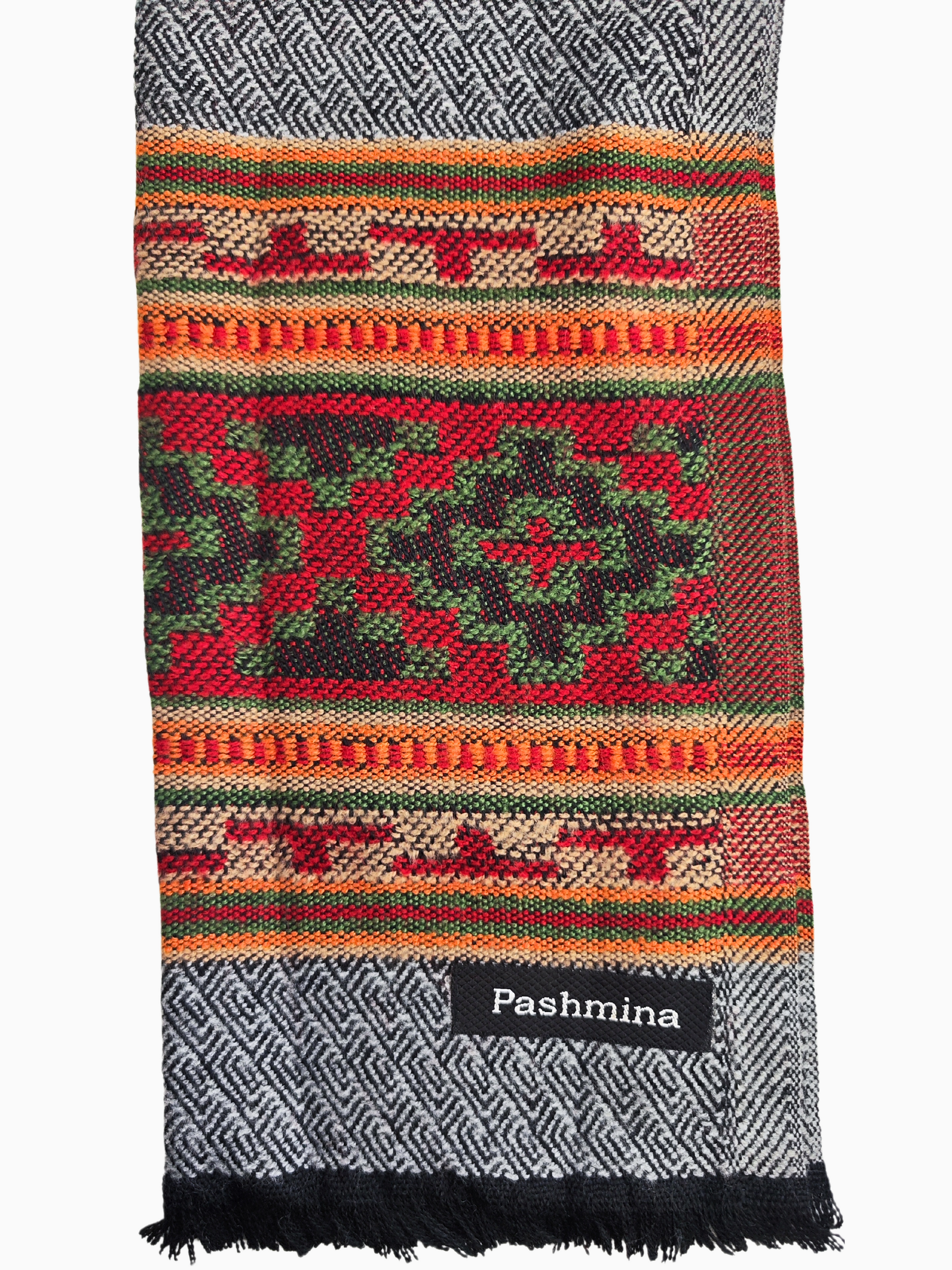 Vintage Light Gray Pashmina Wool Scarf with Colourful Tribal Pattern Wide Border
This vintage wool scarf is a beautiful blend of classic style and vibrant colour. The main body of the scarf is a soft, warm grey, while the bottom edge features a striking pattern of colourful triangles in shades of red, orange, and green.