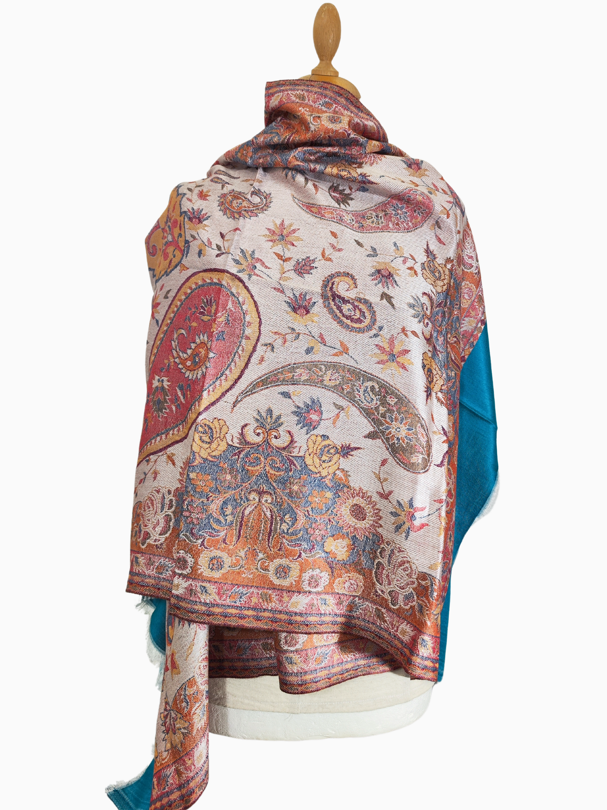 Intricately embroidered pashmina shawl with a swirling paisley design. Handcrafted pashmina shawl with vibrant colours and delicate embroidery.
Soft and luxurious pashmina shawl adorned with a beautiful paisley pattern.
Warm and cosy pashmina shawl with a captivating embroidered design.
Turquoise border, Red, Blu, Green Paisley floral Pattern