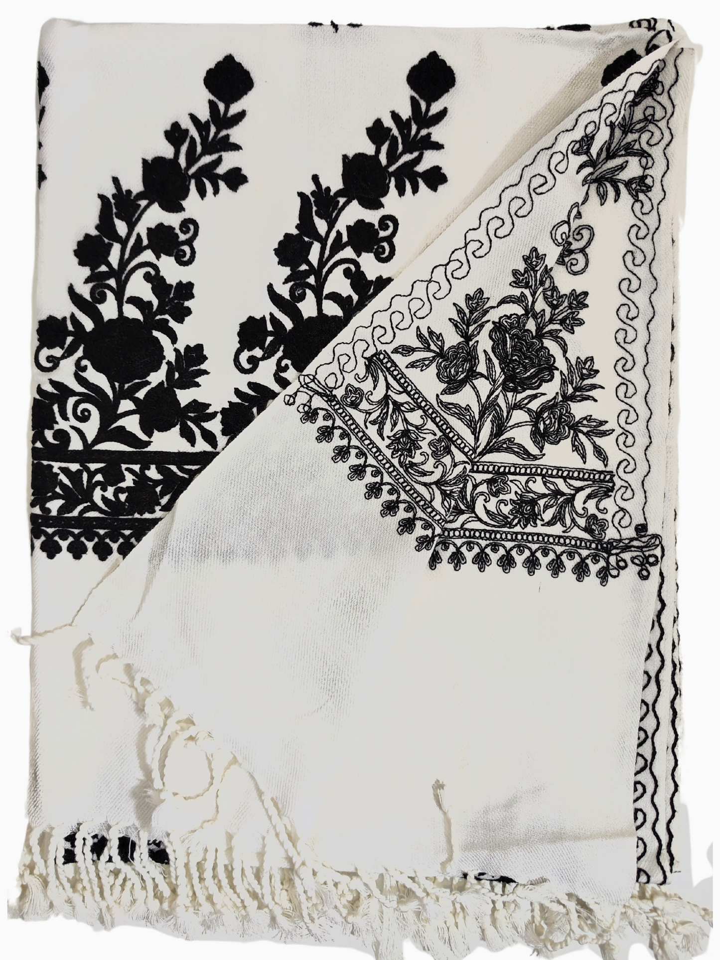 Aari embroidered woollen shawl from Kashmir, featuring intricate floral motifs on a white background. A luxurious woollen shawl from Kashmir, showcasing intricate Aari embroidery with delicate floral motifs. The white shawl features black embroidery and a fringed edge. Aari embroidery shawl. Kashmir shawl. woollen shawl. embroidered shawl. Indian shawl. Pashmina shawl