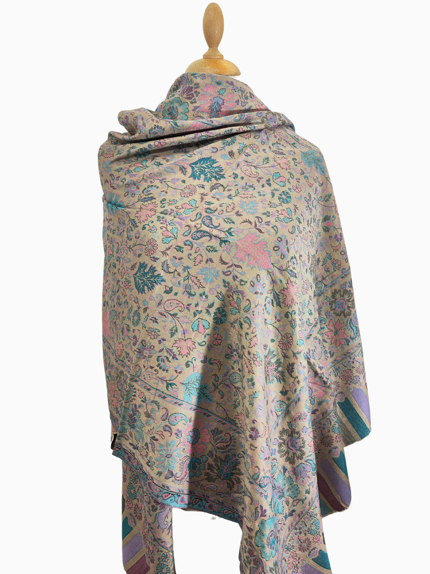 Soft, beige scarf with a delicate floral and paisley pattern in shades of pink, blue, and green 