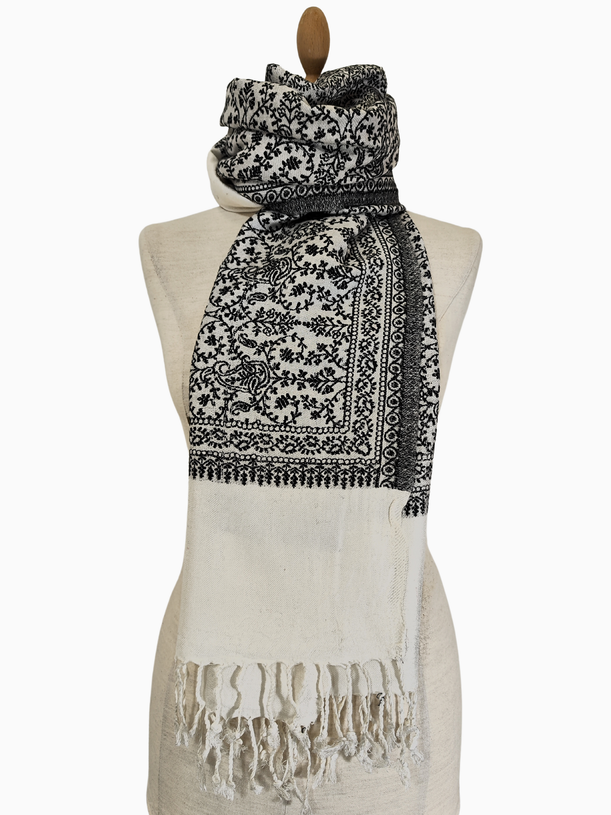 Beige shawl with intricate black embroidery detailing along the edges, lightweight and elegant for versatile styling