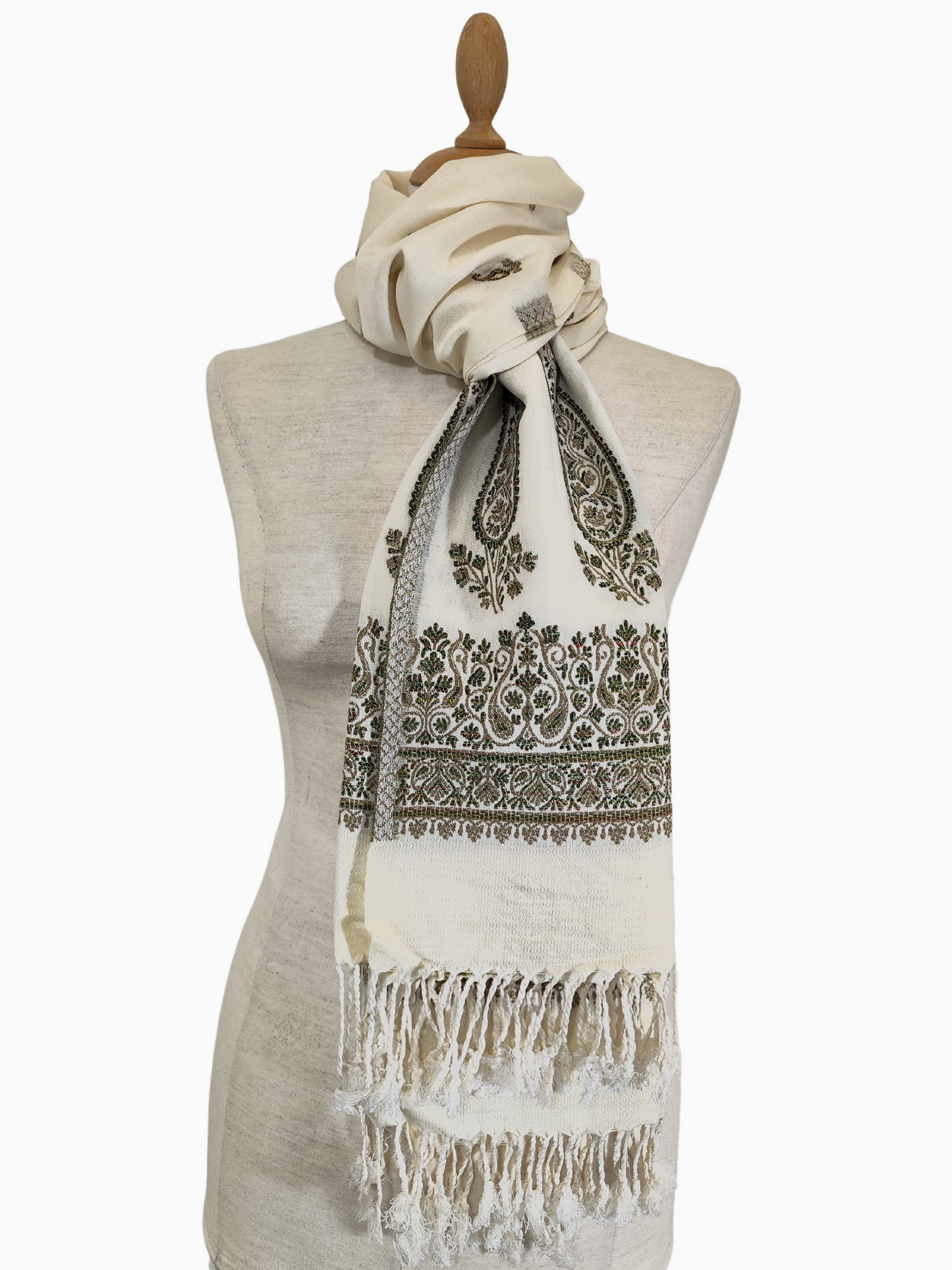 Elevate your wardrobe with this versatile Beige-coloured cotton silk blend shawl. The classic black paisley pattern adds a touch of sophistication, making it perfect for both casual and formal occasions. Drape it over your shoulders, use it as a scarf, or tie it around your waist for a boho chic look.