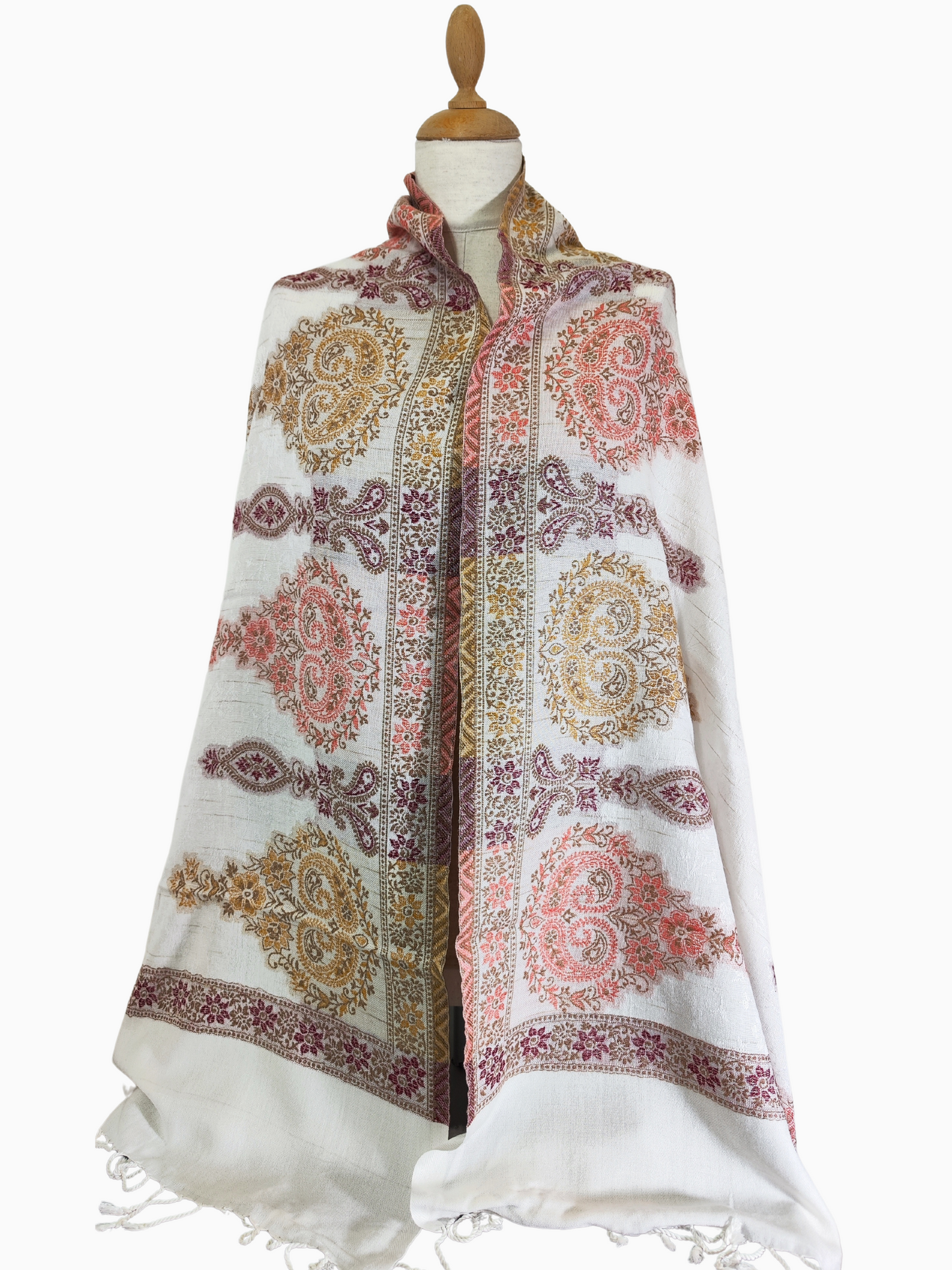 Exquisite white shawl is a masterpiece of woven artistry. It features a captivating paisley pattern that adds elegance to any outfit.