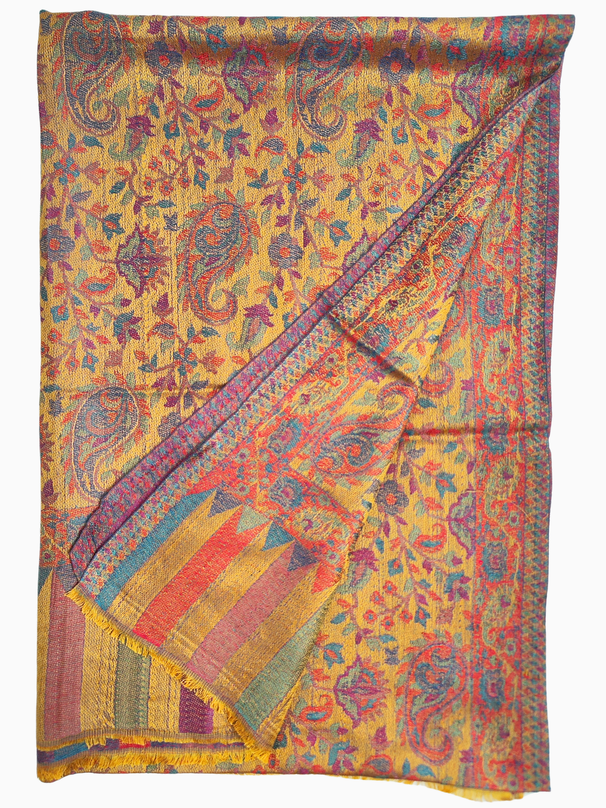 A stunning Pashmina Silk blend shawl with a vibrant yellow base and intricate paisley motifs in shades of red, blue, and green. The shawl is draped elegantly over a mannequin, showcasing its soft, woven fabric and delicate fringed edge.