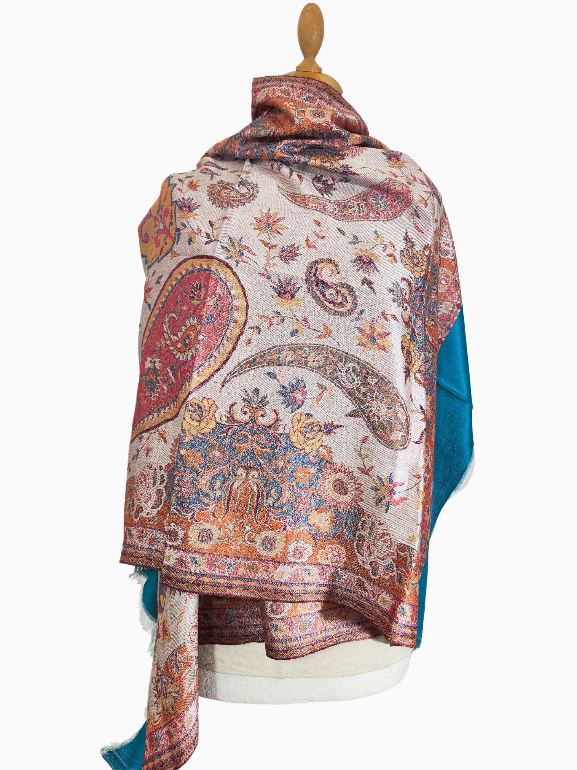 Intricately embroidered pashmina shawl with a swirling paisley design. Handcrafted pashmina shawl with vibrant colours and delicate embroidery.
Soft and luxurious pashmina shawl adorned with a beautiful paisley pattern.
Warm and cosy pashmina shawl with a captivating embroidered design.

Turquoise border, Red, Blu, Green Paisley floral Pattern