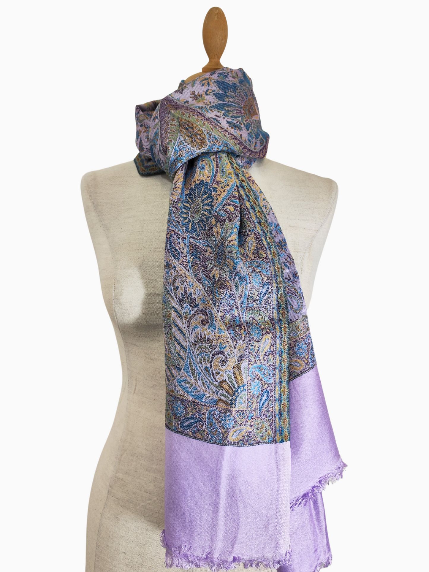 A rectangular shawl with a vibrant peacock design, featuring muted colors like purple, blue, and yellow. Luxurious Silk-Wool Blend Pashmina Shawl with Intricate Paisley Design, Light and Warm, Stylish, fashion, Reversable shawl