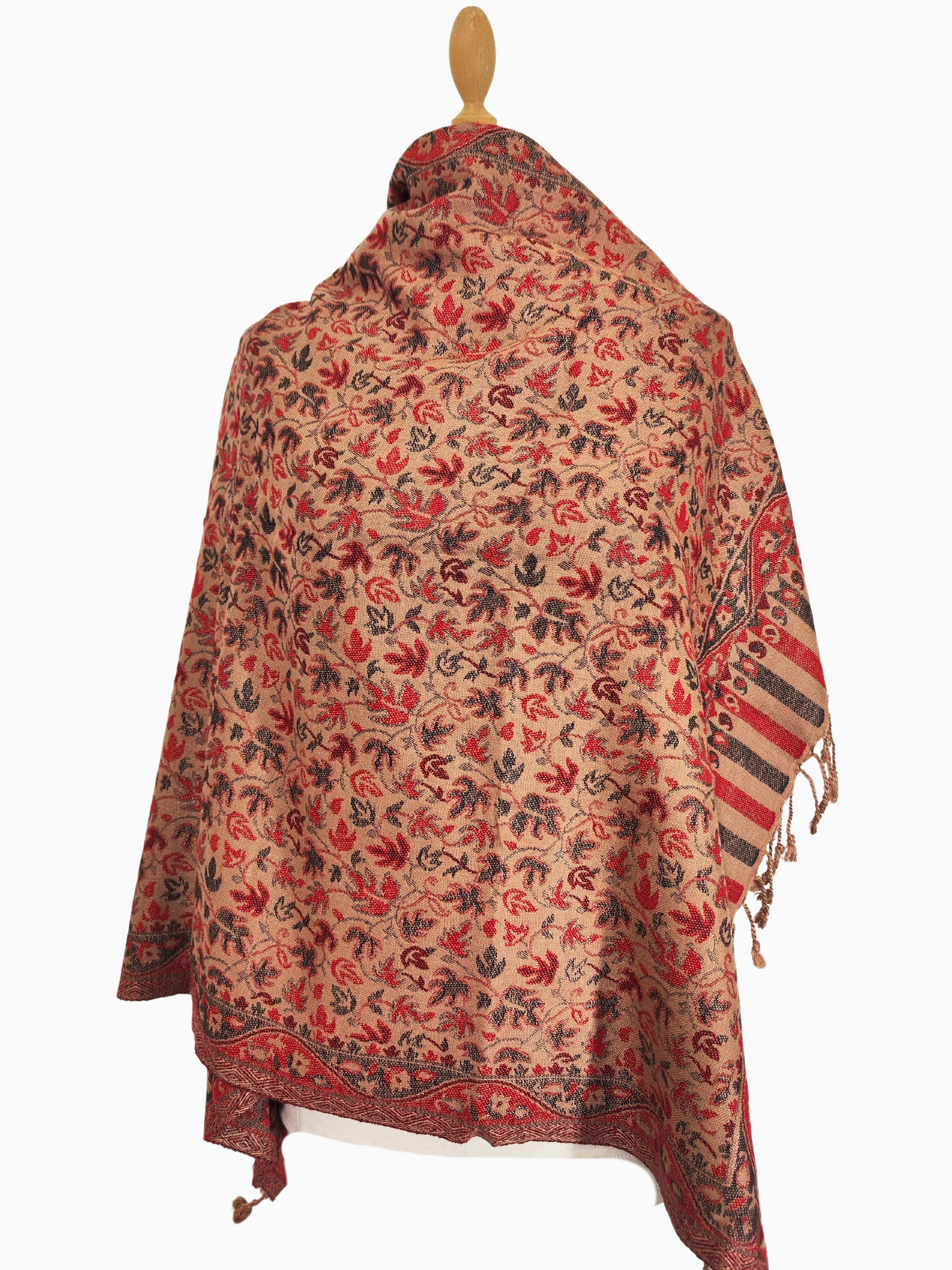 A pashmina shawl in warm red, brown, and cream tones with a floral and leaf pattern.

A luxurious pashmina shawl with intricate floral and leaf motifs, featuring a rich border and warm autumnal colours.

A soft, fine pashmina shawl in a warm colour palette, adorned with delicate floral and leaf patterns.

A whisper of autumn in a pashmina shawl, with warm colours and a delicate floral dance.